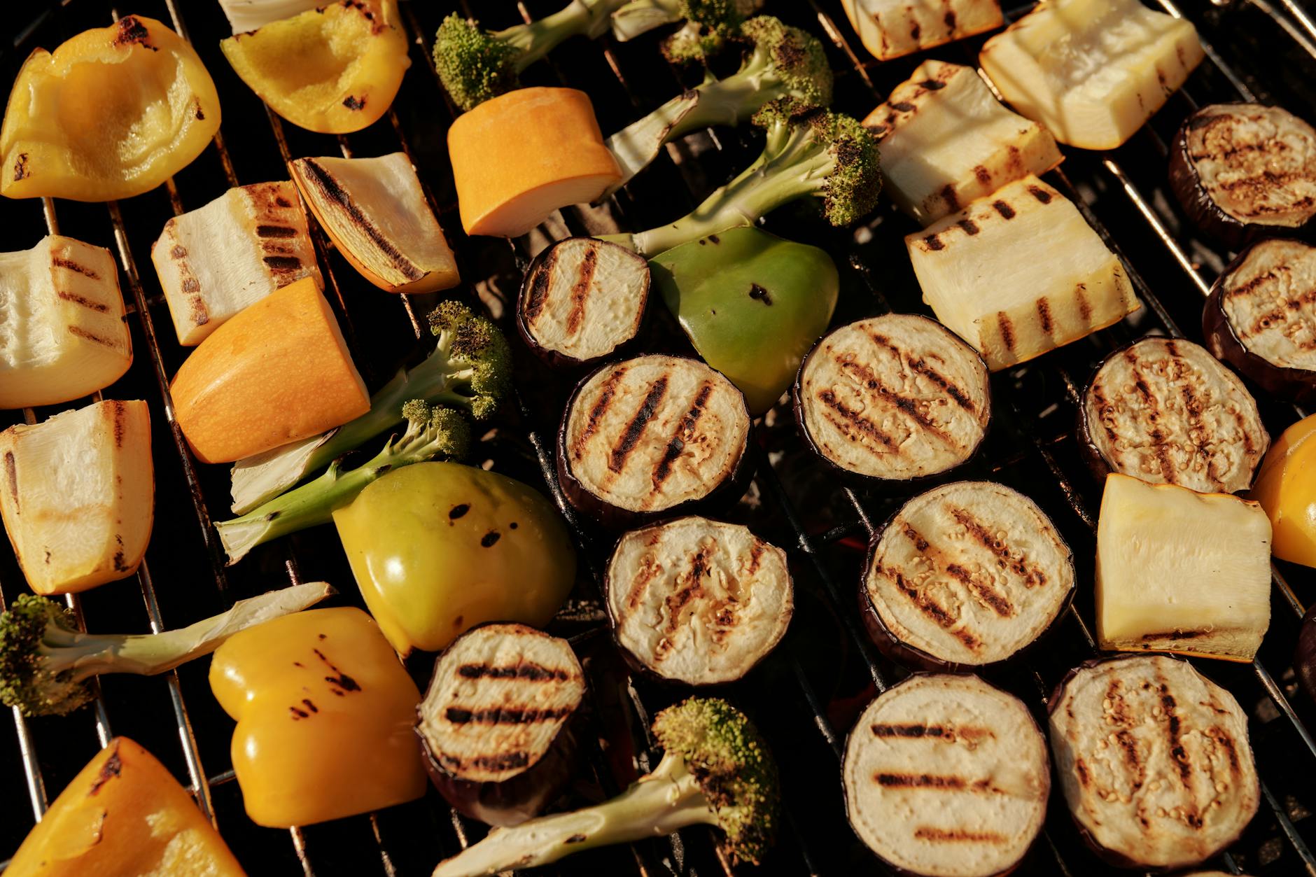 Close-up of assorted vegetables grilling on a barbecue for a healthy meal.