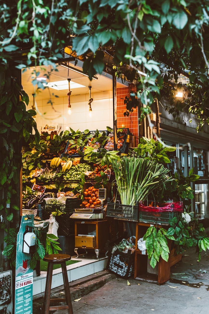 An inviting organic grocery store exterior showcasing fresh, vibrant produce and leafy greens.